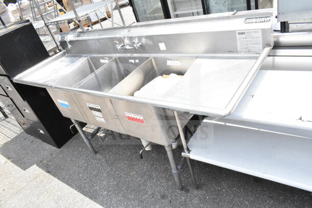 Duke Commercial 3 Bay Sink with dual drain boards, faucet, and handles; stainless steel, used condition, visible Subway markings.