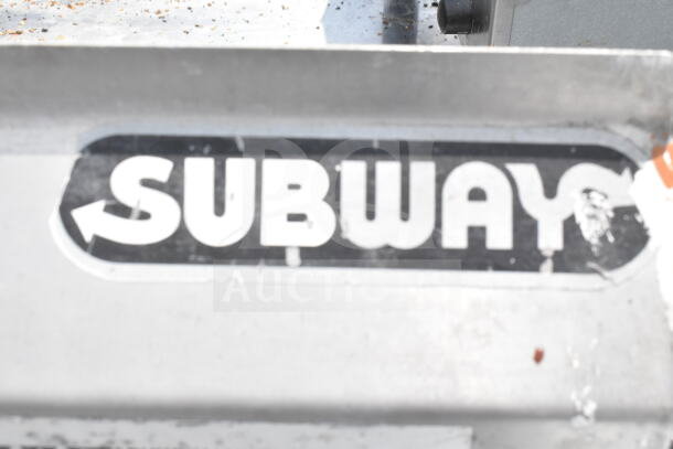 Duke Commercial 3-bay sink with dual drain boards and faucet handles, used condition, Subway branding visible.