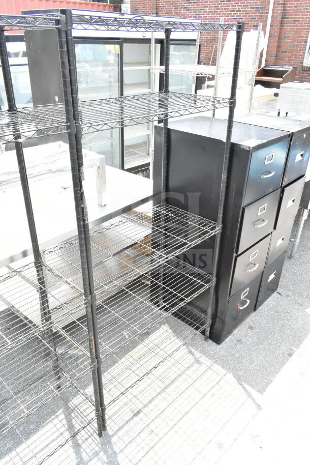 Black 5-tier wire shelving unit for auction; sturdy metal construction, ideal for storage. Buyer must dismantle.