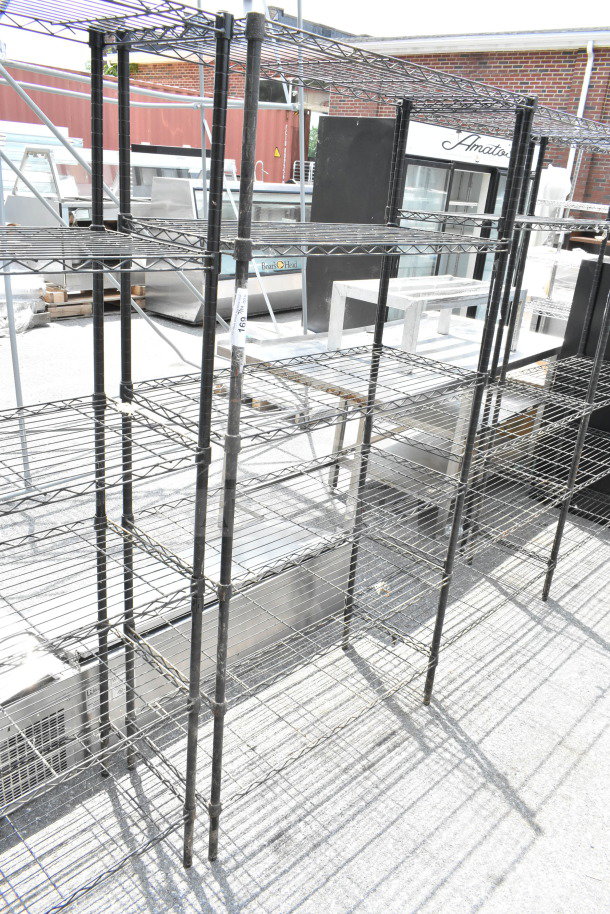 Black 6-tier wire shelving unit, sturdy with visible welds, in good condition. Buyer must dismantle, freight needed.