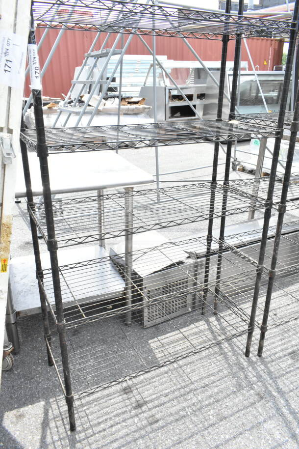 Black 6 tier wire shelving unit, sturdy, needs dismantling by buyer. Ideal for storage, potential freight costs.