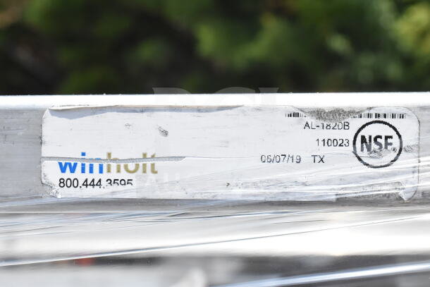 Winholt commercial pan transport rack, model AL-182DB, on commercial casters. NSF certified. Visible barcode and label.