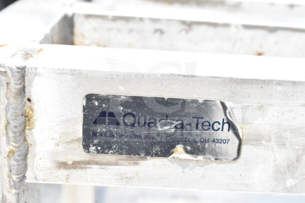 Commercial Dunnage Rack by Quadra-Tech, showing visible wear. Label includes address: 364 E Jenkins Ave, Columbus, OH 43207.