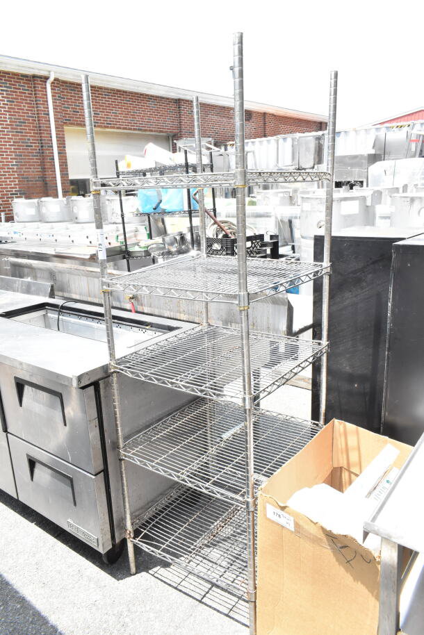 Chrome finish 5 tier wire shelving unit, industrial style, outdoor setting, dismantling required for buyer, freight applies.