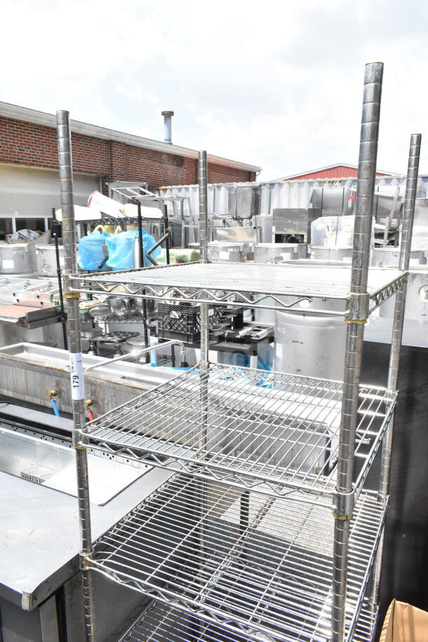 Chrome finish 5-tier wire shelving unit in used condition, suitable for storage. Buyer must dismantle.