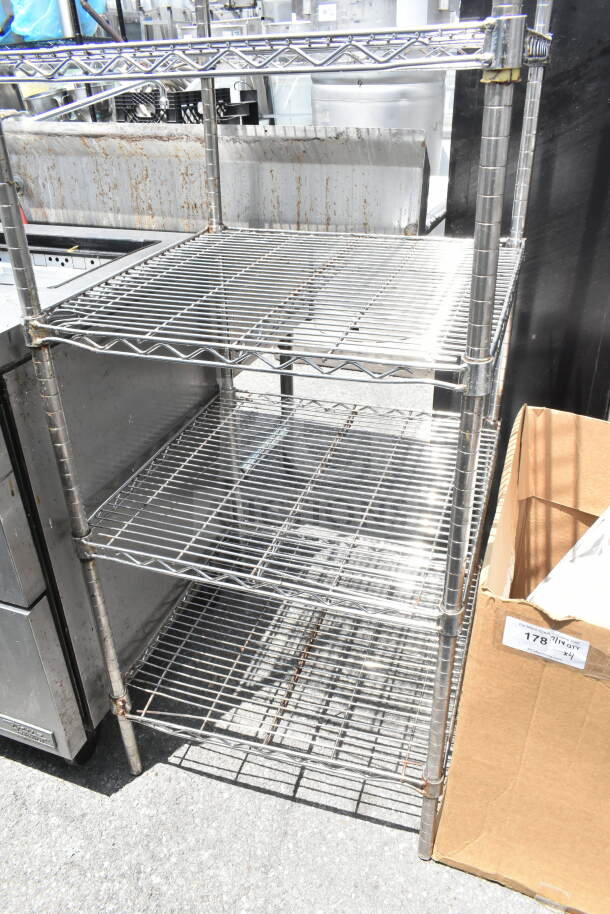 Chrome finish 5-tier wire shelving unit in used condition, ideal for storage. Buyer must dismantle for transport.