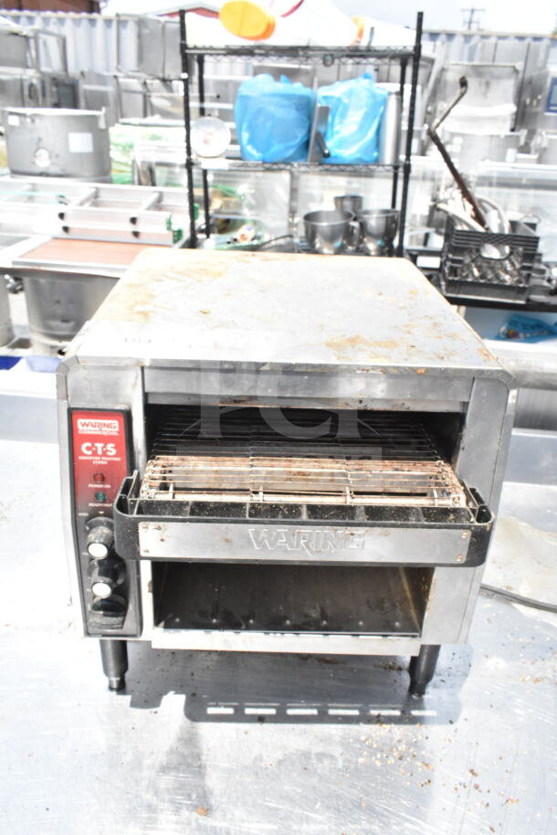 2021 Waring CTS1000B commercial conveyor toaster, 208V, showing visible wear, with control knobs and Waring branding.