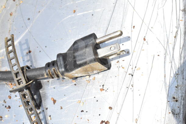 Black power plug for a 2021 Waring CTS1000B Commercial Conveyor Toaster Oven, showing metal prongs and cable.