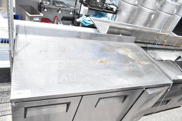 True 2 Door Work Top Cooler, stainless steel, 115 volts, 1 phase, some surface wear, brand label visible.