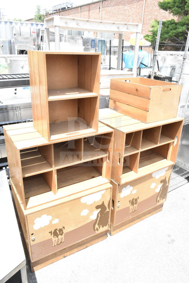Two wooden cabinets with open shelves, farm animal motif on lower doors, good condition, perfect for rustic decor.
