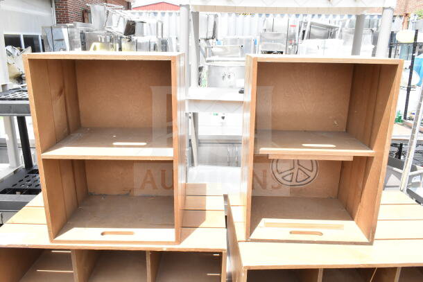 Two wooden cabinets with shelves, peace symbol cutout, natural finish, in used condition, ideal for storage or display.