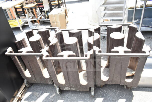 Three brown poly dish carts with commercial casters, stackable design, showing light wear. Ideal for catering or restaurant use.