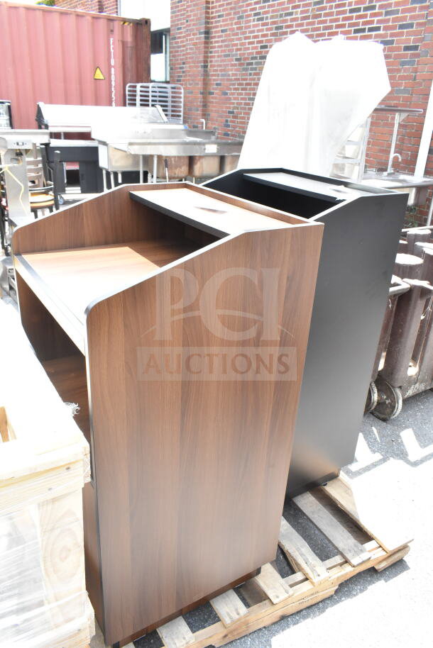 2 new Lancaster host stations, 46", black and walnut. Scratch and dent items on wooden pallets.