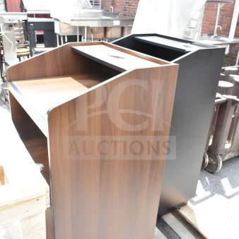 2 new Lancaster host stations, 46", black and walnut. Scratch and dent items on wooden pallets.