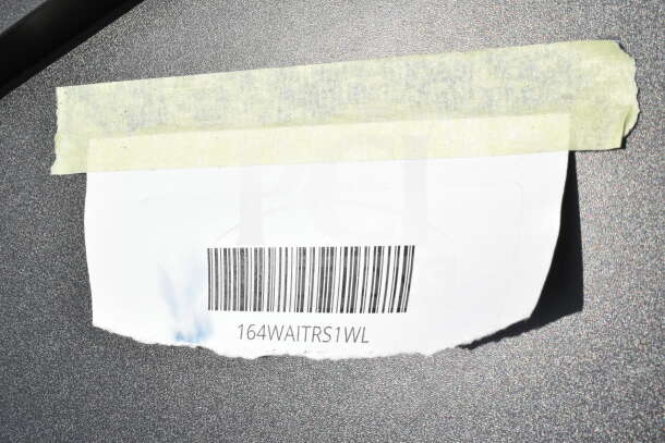 Barcode with model number 164WAITRS1WL taped on a Lancaster Table & Seating host station.