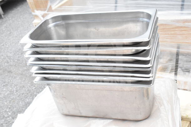 Stainless steel drop-in bins stacked, new condition, part of 12-item auction lot.