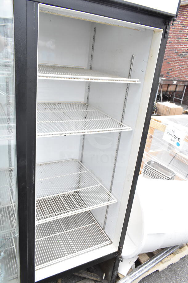 Beverage Air MT72 commercial 3-door reach-in cooler, used, 115V, 1 phase, with wire shelving and glass front, some wear visible.