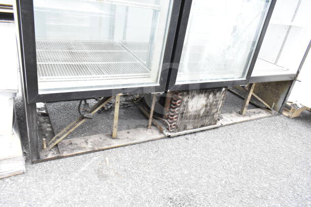 Beverage Air MT72 commercial cooler, 3-door reach-in, visible wear, 115 volts, 1 phase, glass intact, shelving inside.