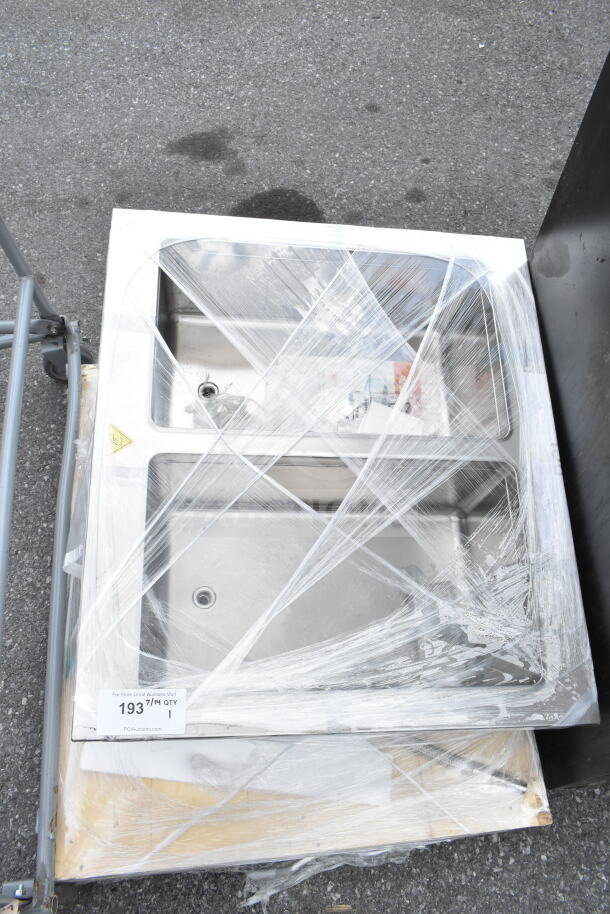 Brand new commercial 2 bay drop-in unit, stainless steel, slight scratches, wrapped, labeled as lot 193 for auction.