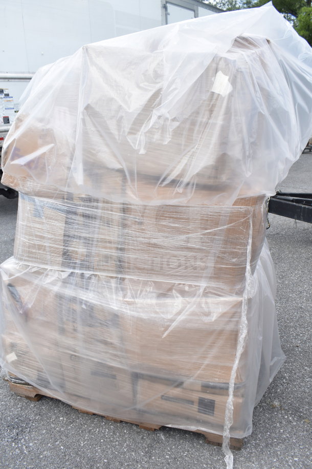 28 new scratch and dent items on a pallet, covered in plastic. Includes pizza screens, portion spoons, pie pans, mason jars.