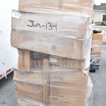 Pallet of 20 brand new scratch and dent items, including sink, glass rack, and food pan carrier. Marked "Jun-134." Wrapped in plastic.