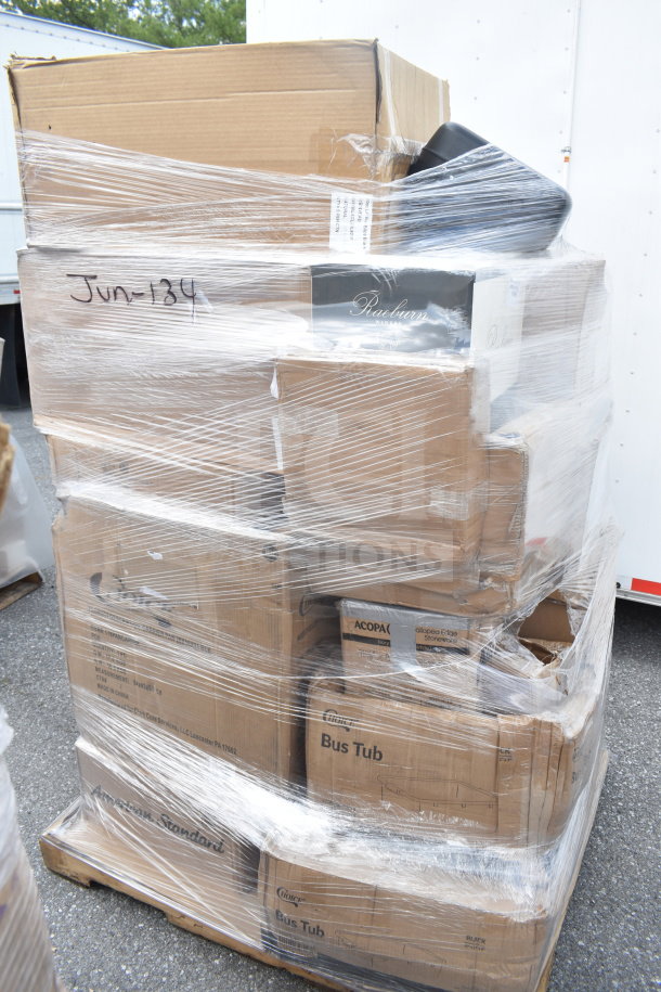 Plastic-wrapped pallet containing scratch and dent items, including sink, glass rack, and food pan carrier; labeled "Jun-134."