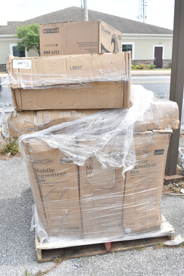 Pallet with boxes of new Baker's Lane Mobile Ingredient Bins, wrapped in plastic. Visible labels indicate 21-gallon capacity.