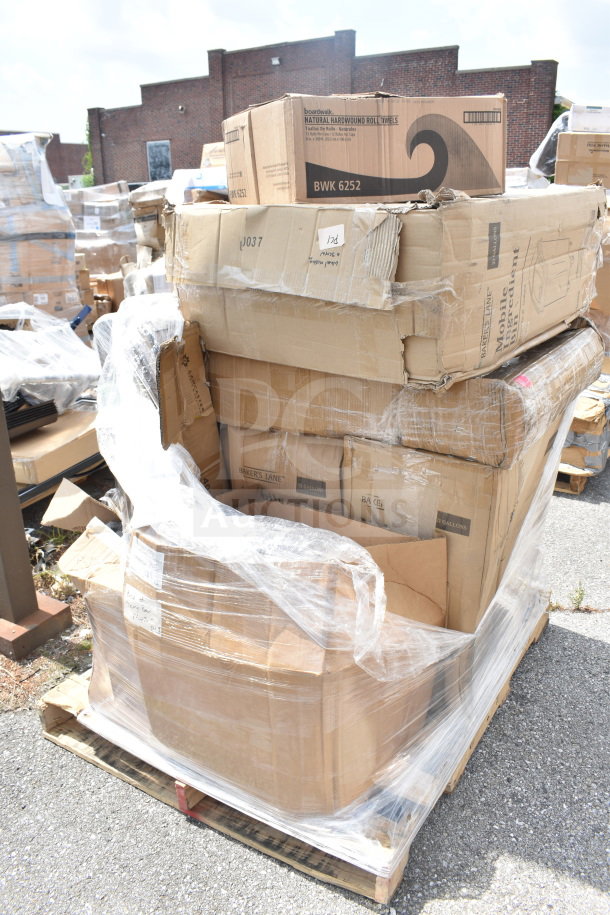 Nine new scratch and dent items on a pallet, including ingredient bins. Boxes show signs of damage, wrapped in plastic.