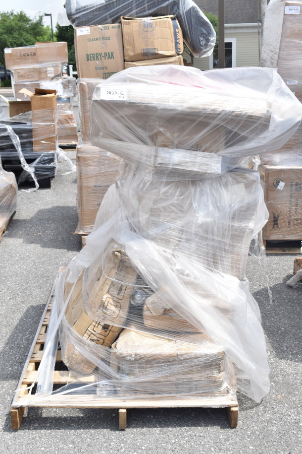 Pallet with 9 scratch and dent items including solid wood tabletop and trash can lids, wrapped in plastic and cardboard.