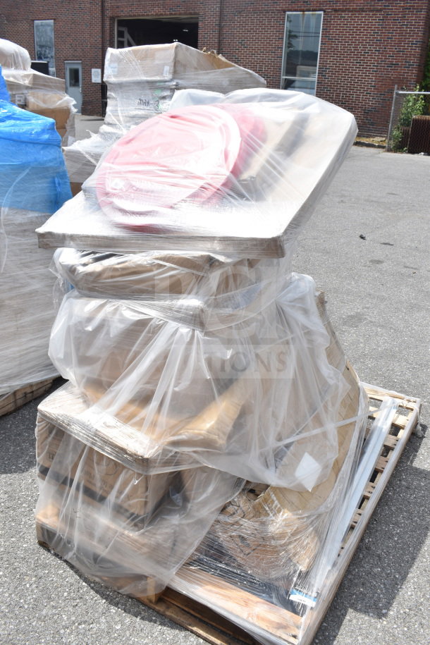 Auction lot of 9 scratch and dent items including solid wood table top, trash can lids, wrapped in plastic on a pallet.