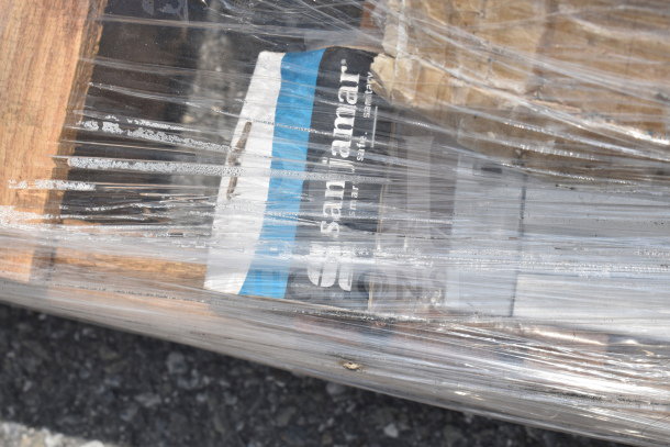 Nine new scratch and dent items including solid wood tabletop, trash can lids, wrapped in plastic. Visible "San Jamar" label.