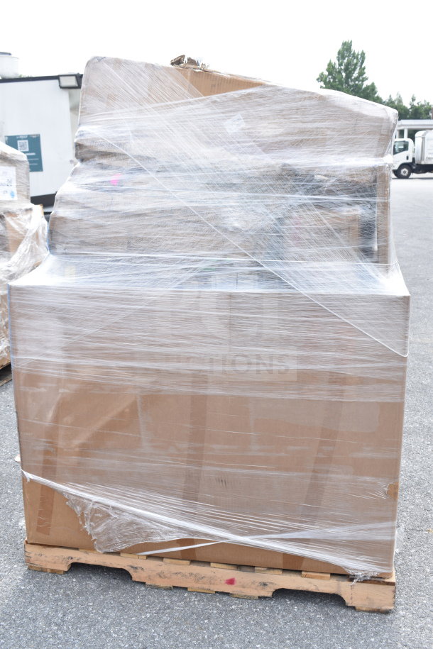 Pallet of 15 new scratch and dent items, including chairs, wrapped in plastic for auction, cardboard boxes visible.