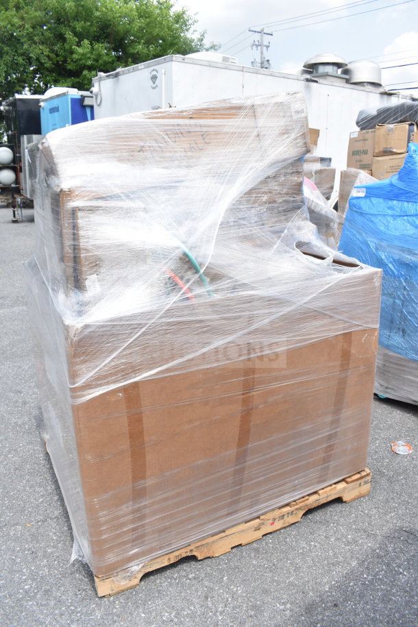 Pallet wrapped in plastic with 15 new scratch and dent items, including chairs, marked for auction.