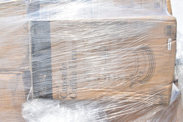 Plastic-wrapped boxes of various kitchen items, including steam table pan, sediment tray, and wire shelf, labeled "60 CUP Capsule Coffee Urn."