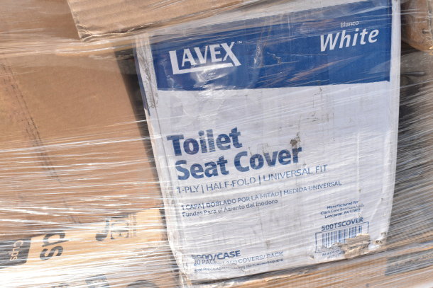 Wrapped pallet of Lavex toilet seat covers. Box shows "1-ply, universal fit, 5000/case." Contains scratch and dent items.