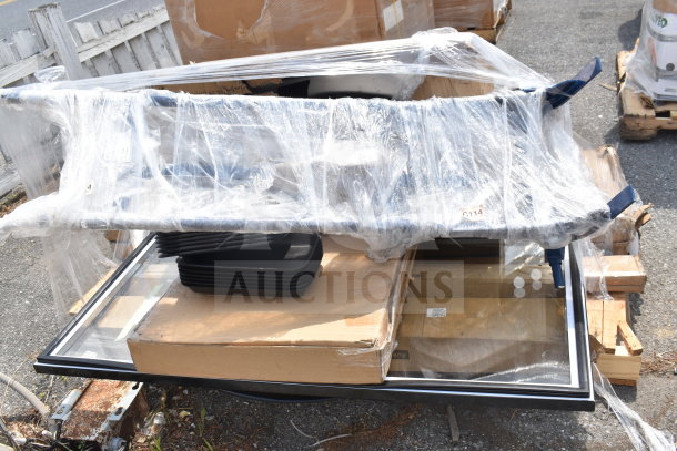 Bundle of 12 new scratch and dent items, including ice bin and shelf, wrapped in plastic, visible cardboard boxes.
