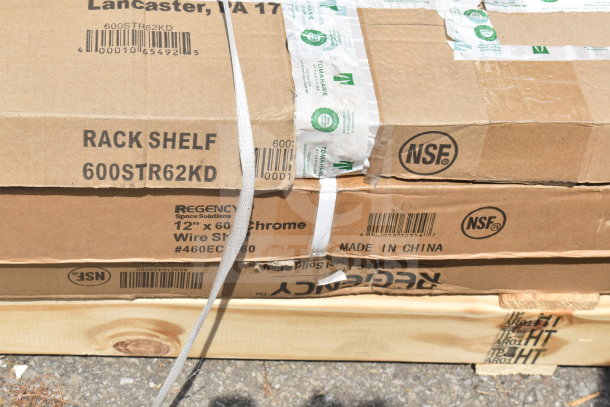 Stack of cardboard boxes containing mixed new items, including a Regency 12" x 60" chrome wire shelf model 600STR62KD, marked with NSF certification and "Made in China" label. Boxes show minor wear.