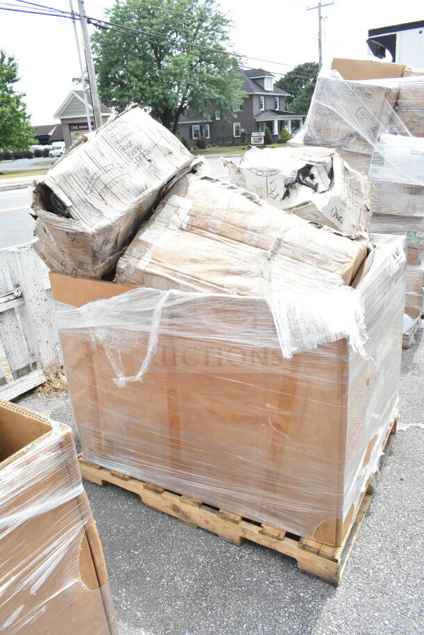 Pallet of scratch and dent items, wrapped in plastic; includes compressor, hotel pans, containers. Box labels partially visible.