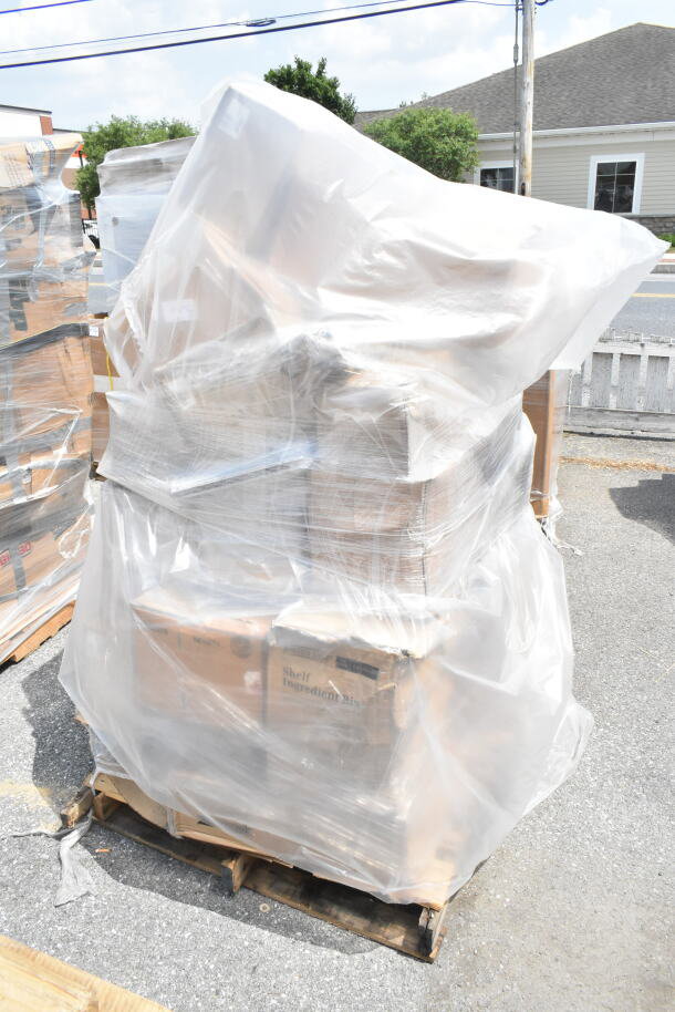 Pallet with 34 new scratch and dent items including trays, sake cup, shelves, wrapped in plastic. Auction lot MAY26-120.