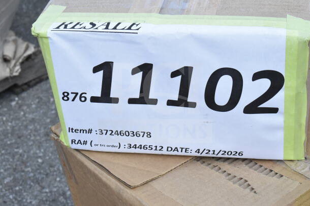 Cardboard box labeled with "Resale" and large number "11102," accompanied by codes and a future date, indicating auction details.