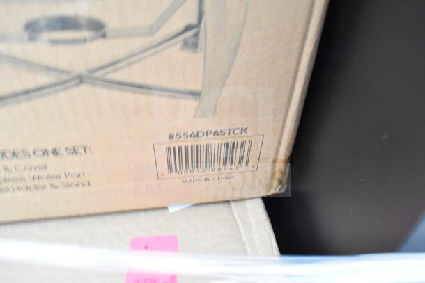 Cardboard box with barcode #556DP6STCK, labeled "Made in China," containing new scratch and dent items including chafers and silicone spatula.