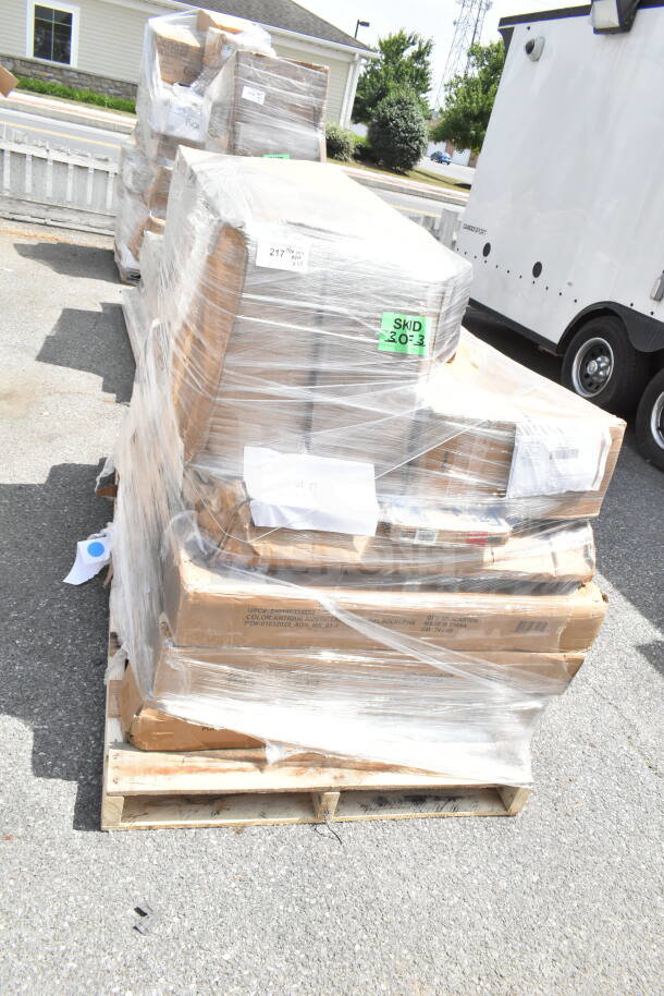 Pallet of 14 brand new scratch and dent items, including table, speed rail, and ice bin, wrapped in plastic.