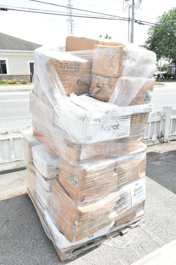 Pallet with 29 boxes of scratch and dent items, including plastic cups, containers, and gloves, wrapped in plastic.