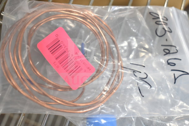 Brand new HP203126A Beverage-Air cap tube in packaging, labeled with model number and details, showing scratch and dent condition.