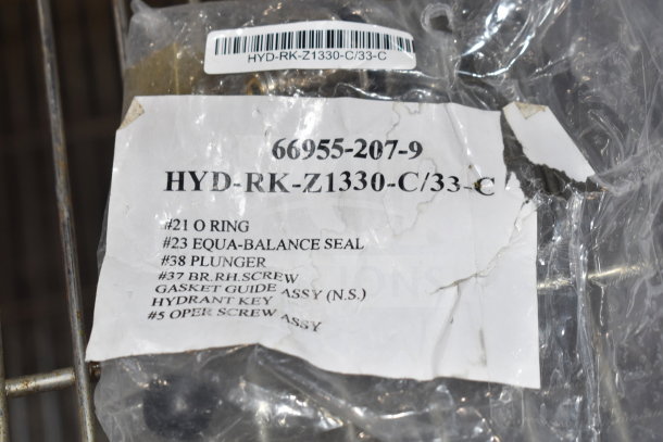 4 new scratch-and-dent items, including a Zurn Elkay HYD-RK-Z1330-C wall hydrant repair kit, visible label details.