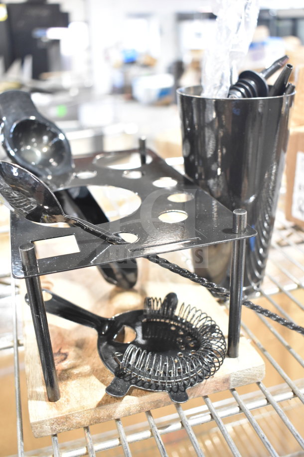 16 brand new kitchen items featuring a cylindrical bin, pourers, stirring spoon on display. Some items may have minor scratches or dents.