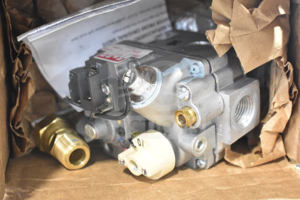 Brand new Robertshaw 7000BMVR gas valve, visible minor scratches and dents, in original packaging with labels shown.