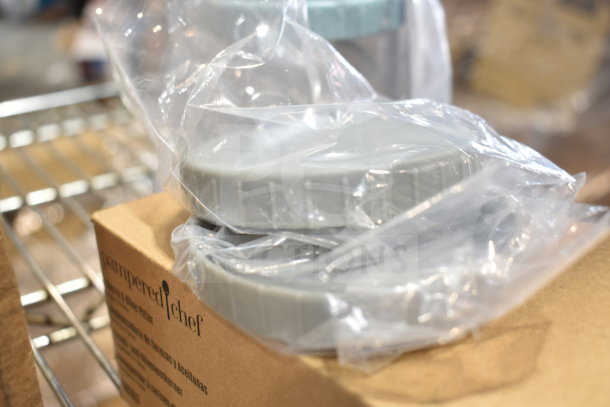 Pampered Chef Cherry & Olive Pitter in box, new condition, with scratch-and-dent packaging.