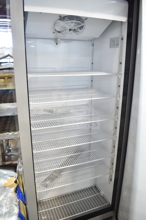Migali SF60V commercial single door reach-in freezer, 115 volts, 1 phase, features six wire shelves, fan, and interior light.