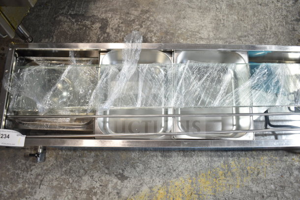 Brand new Avantco 177BMFW5 electric bain marie buffet warmer, 57" with 5 half-size wells. Scratch and dent condition.